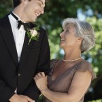 Portrait of a groom posing with his mother at a wedding